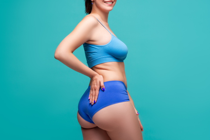woman showing her body results after body contouring