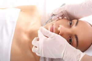 beautiful woman during dermaplaning procedure