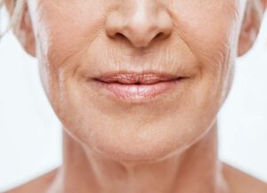 Cropped shot of a mature woman's mouth full of wrinkles