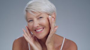 Portrait of the face of a senior woman smiling for skincare about Facial Treatment for Aging Skin.