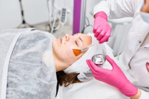 patient getting a full body chemical peel on her face